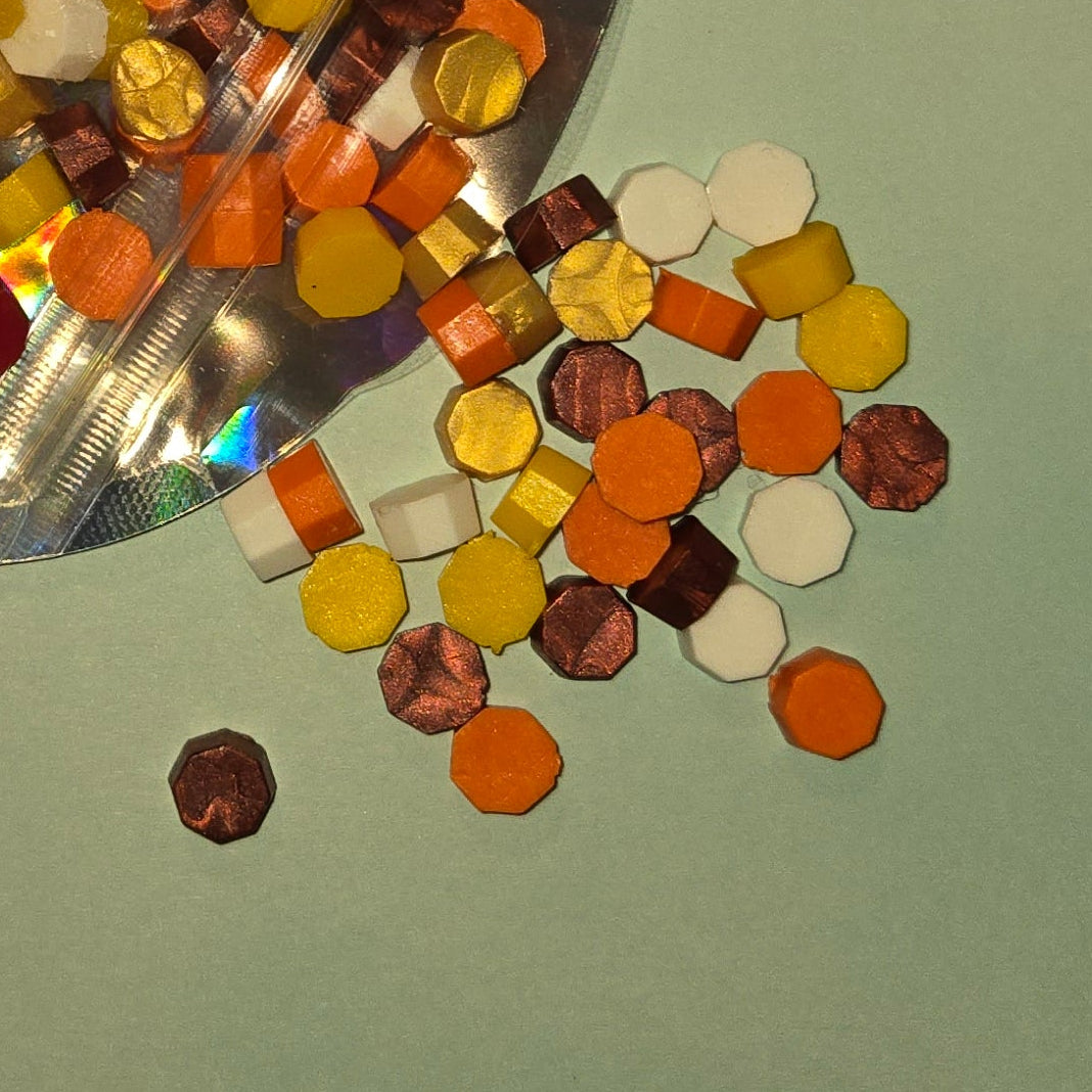 A warm blend of bronze, orange, yellow, and ivory