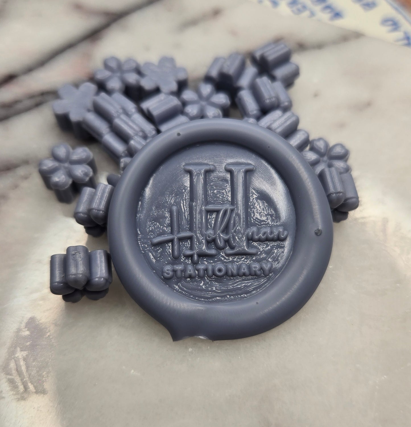 a calm grey-blue that drifts between mist and sky, soft as distant peaks at dawn.