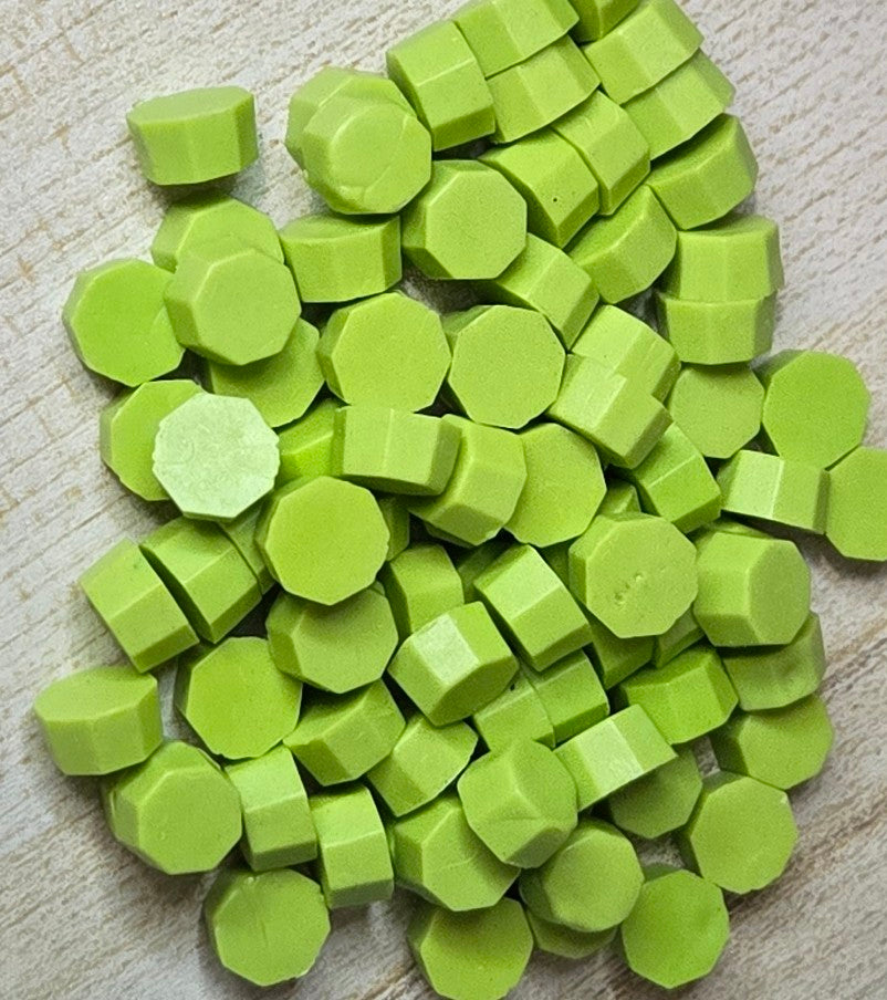 soft, nutty green wax seal bead with a creamy undertone that evokes vintage charm and subtle elegance