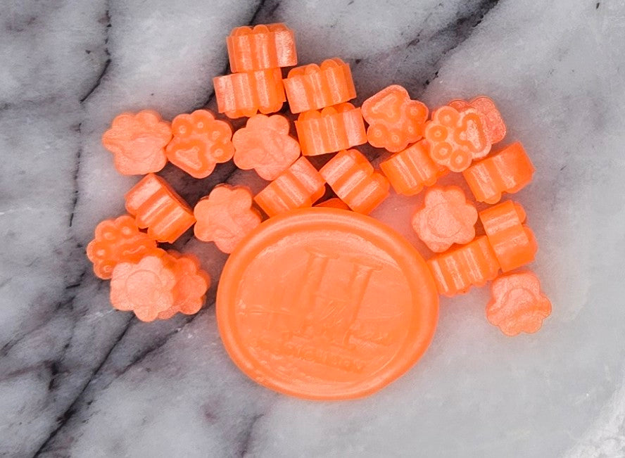 deep, cosmic black wax seal bead flecked with glittering specks that shimmer like distant stars in the void